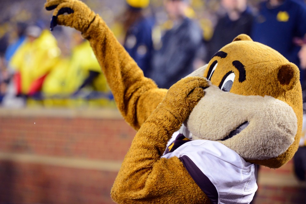 Gold the Gopher displays disgust toward a blue piece of Michigan confetti during the game against Michigan on Saturday, Nov. 4, 2017 in Ann Arbor, Mich. 