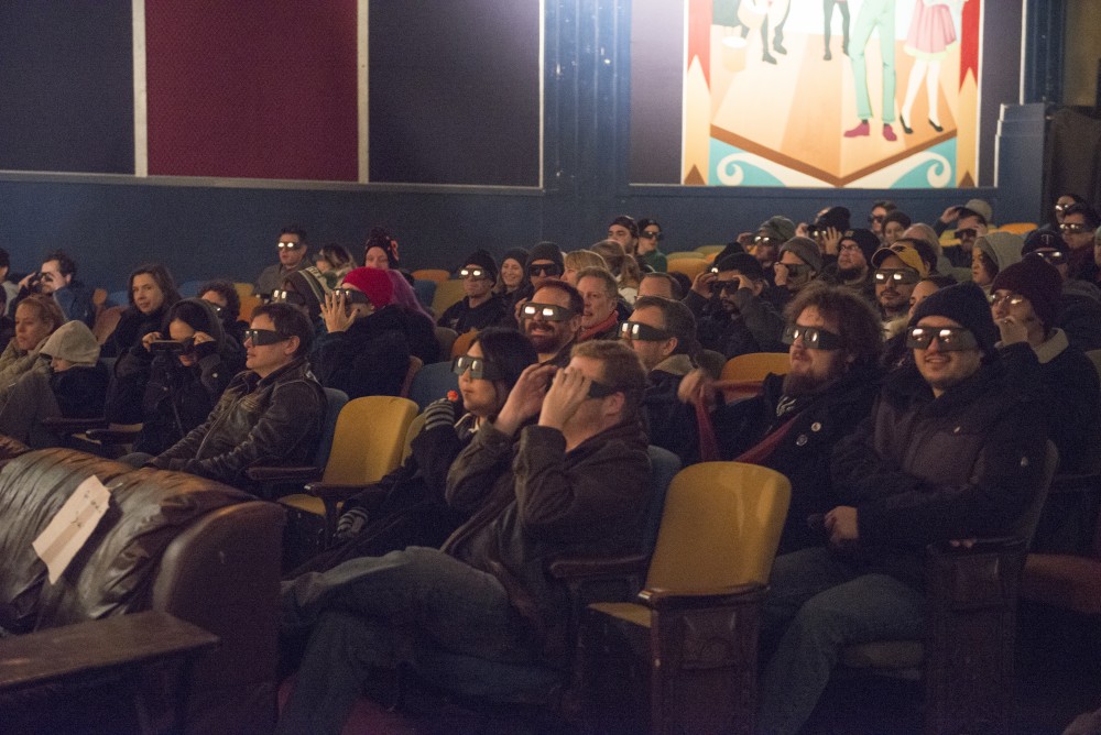 Moviegoers put on glasses before viewing the third Friday the 13th in 3D at the Parkway Theater on Friday, Nov. 10, 2017. 