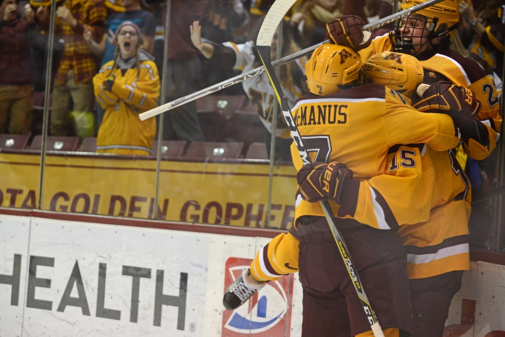 Gophers celebrate their game-tying goal at 3M Arena at Mariucci on Saturday, Nov. 18.