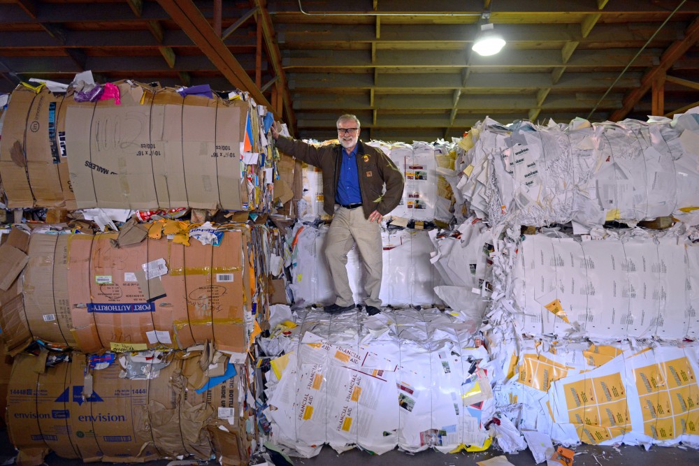 Facilities Support Supervisor Dana Donatucci, known to many as The Recycling Guy, poses for a portrait among bales of recycled materials on Tuesday, Nov. 7 in Minneapolis. Donatucci has been in charge of all things recycling at the University for 30 years.