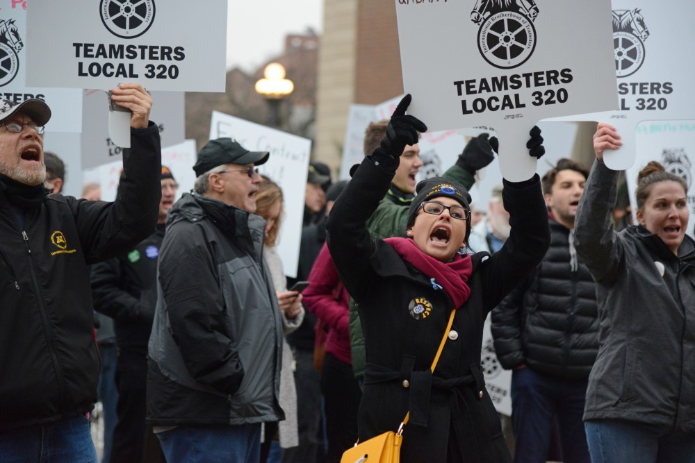 Hannah Bernardson, a business agent for the union group Teamsters Local 320, protests on Friday, Nov. 17 outside Morrill Hall in Minneapolis. The group is pushing for higher wages at the University of Minnesota.
