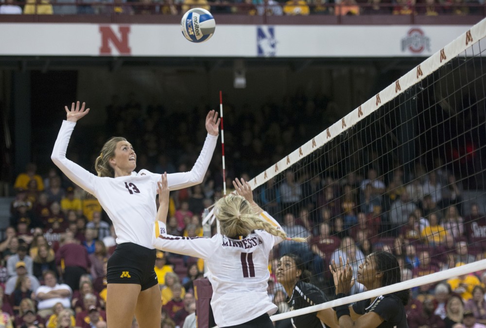Middle blocker Molly Lohman jumps to spike the ball against Purdue on Wednesday, Oct. 11 at the Maturi Pavilion.