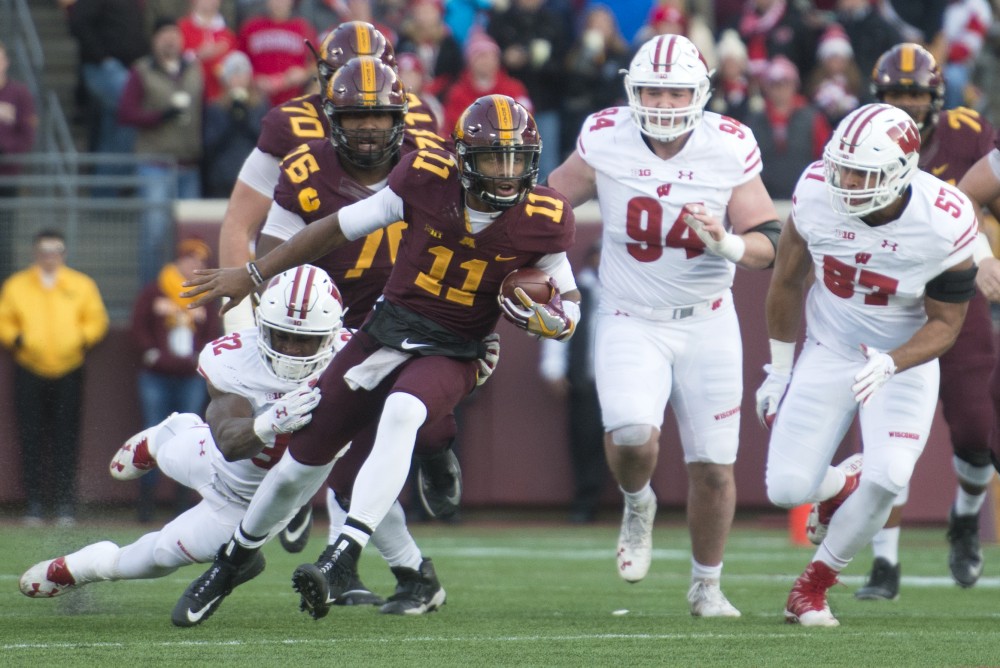 Gophers quarter back Demry Croft rushes the ball at TCF Bank Stadium on Saturday Nov. 25. The Badgers defeated the Gophers 31-0.