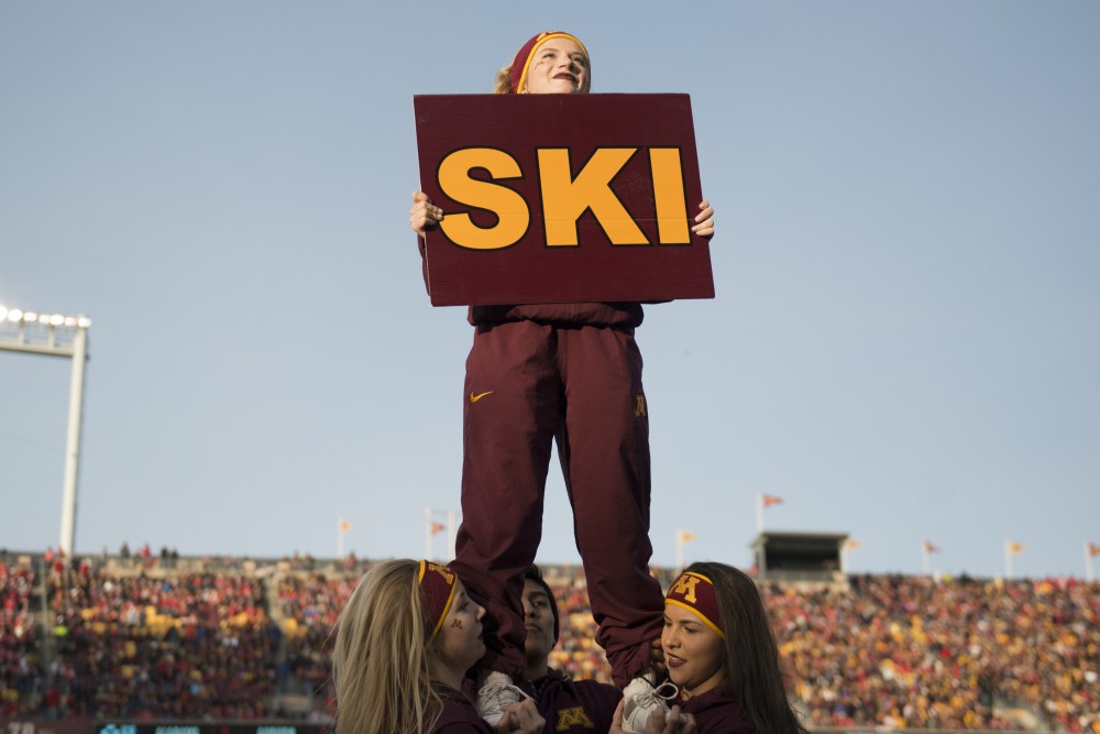 University of Minnesota Small Co-Ed Spirit Squard member Gina Herriges cheers on the Gophers on Saturday, Nov. 25 at TCF Bank Stadium. The Badgers beat the Gophers 31-0.
