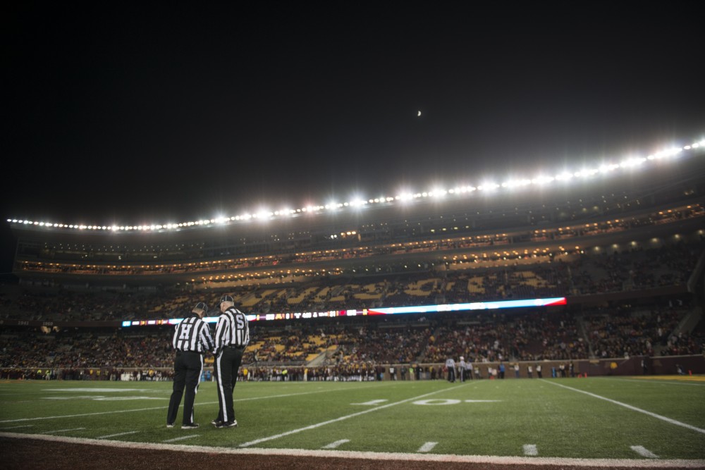 Referees talk during the game against Wisconsin on Saturday, Nov. 25 at TCF Bank Stadium. The Badgers beat the Gophers 31-0.