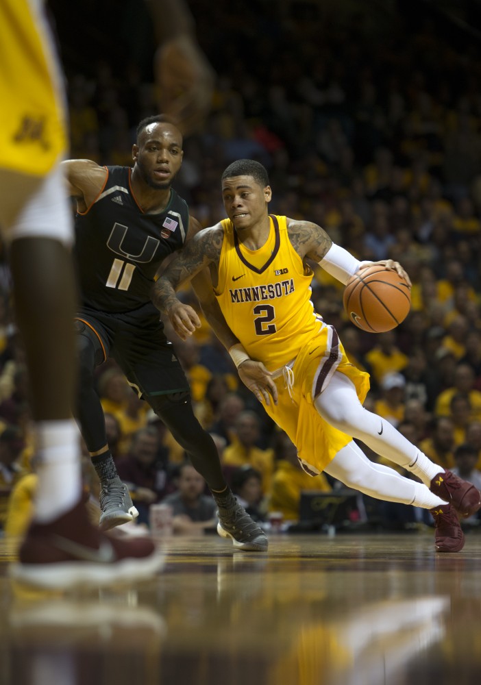 Guard Nate Mason drives towards the hoop at the Williams Arena on Wednesday, Nov. 29. 