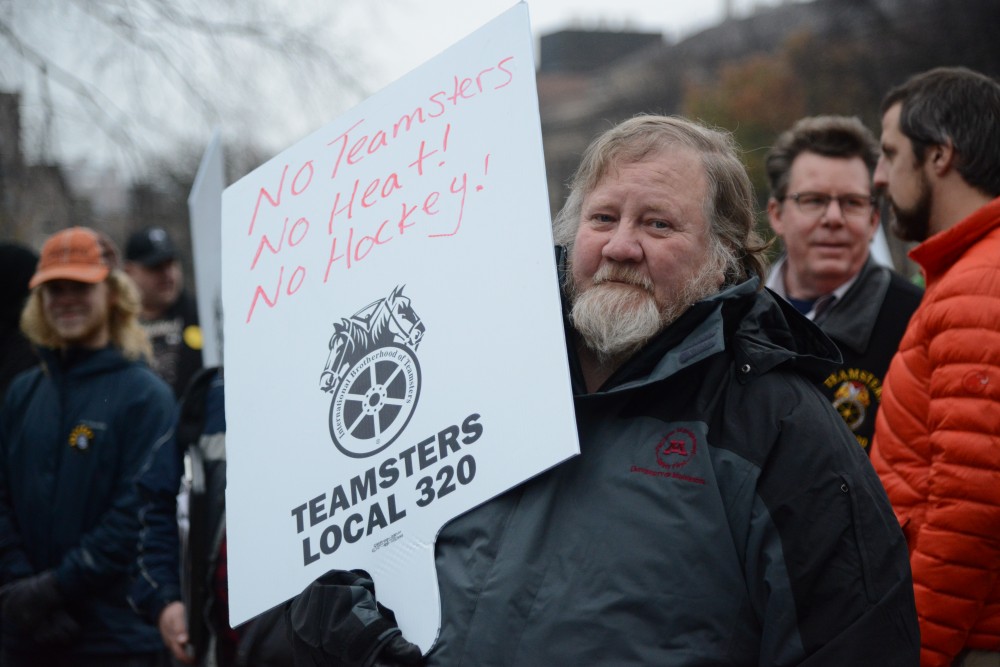 Richard Peka, a custodian in Moos Towers, joins faculty, students and union members in a protest for fair wages at the University on Friday, Nov. 17, outside Morrill Hall in Minneapolis, Minn.