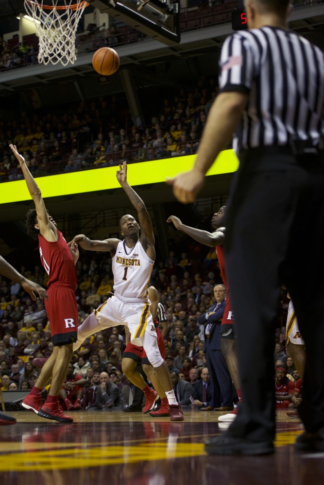 Junior guard Dupree McBrayer follows tosses the ball during a game against Rutgers at Williams Arena on Sunday, Dec. 3. The Gophers beat Rutgers 89-67. 
