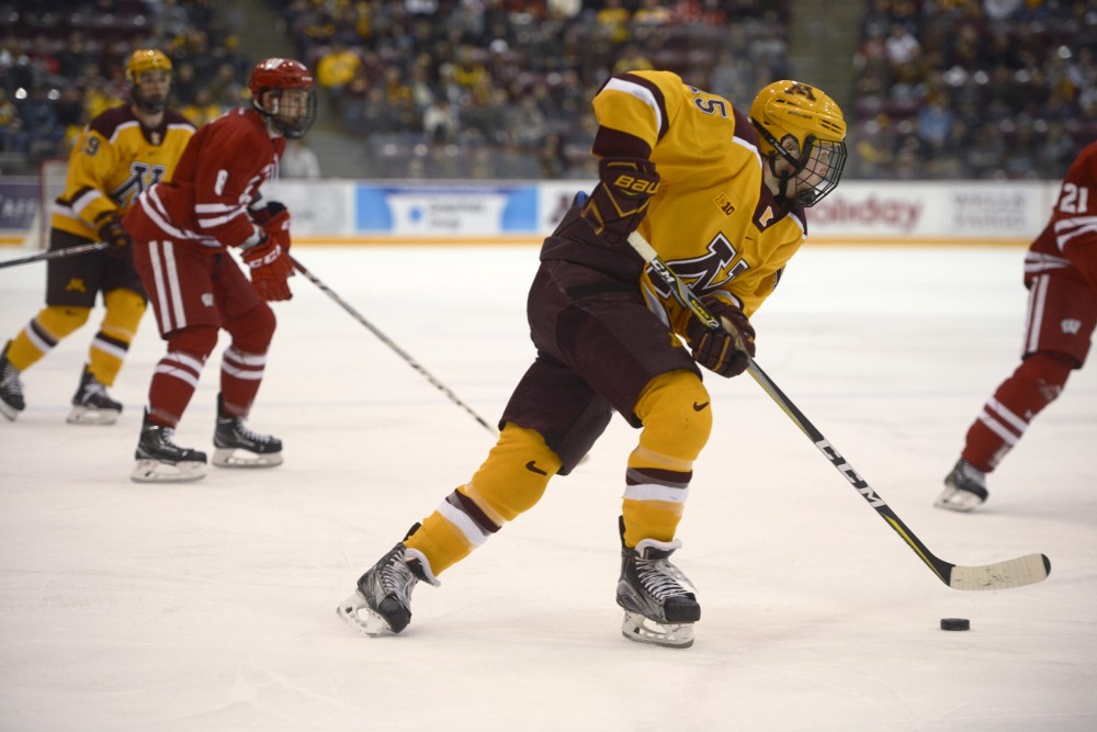 Sophomore forward Rem Pitlick skates with the puck on Saturday, Dec. 2 at 3M Arena at Mariucci. The Badgers beat the Gophers 3-2 in the second game of the series, while Minnesota won 5-4 the previous night.