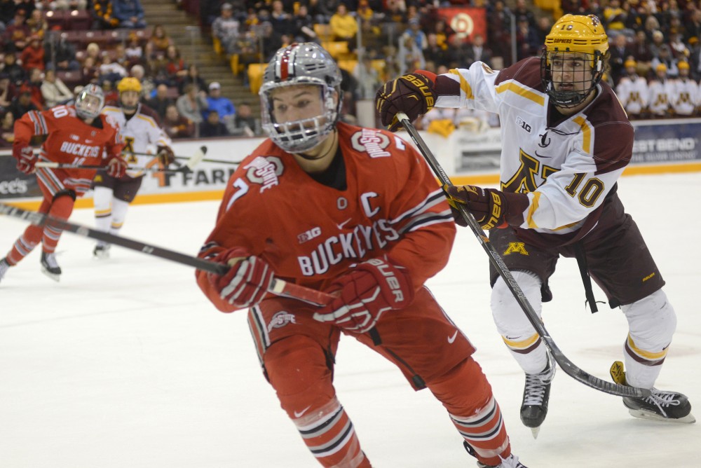 Gophers forward Brent Gates Jr. chases after the puck against Ohio State on Friday, Dec. 2, 2016 at 3M Arena at Mariucci Arena. 