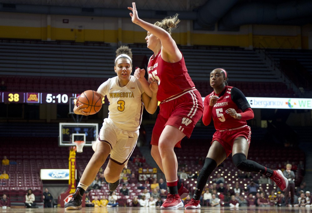 Destiny Pitts circles around to make a shot on the hoop during the game against Wisconsin on Thursday, Jan. 18 at Williams Arena. 