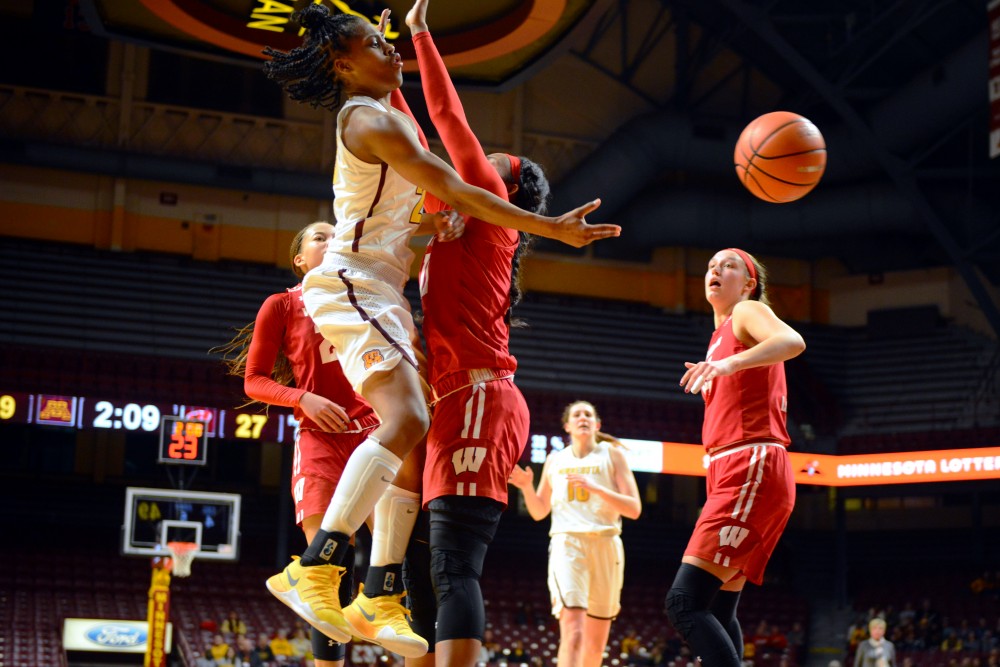 Gophers womens basketball player Kenisha Bell loses control of the ball during the game against Wisconsin on Thursday, Jan. 18 at Williams Arena. 