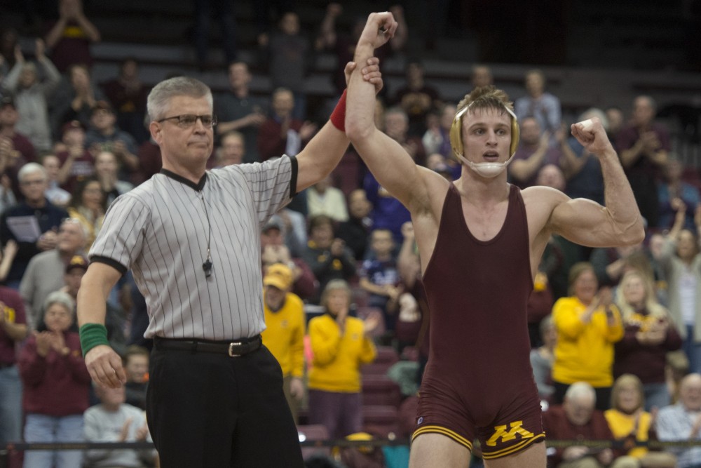 Senior Nick Wanzek at 165 beat out No. 5 Logan Massa by decision during the dual against Michigan, suffering their first loss of the season on Sunday, Jan. 21.