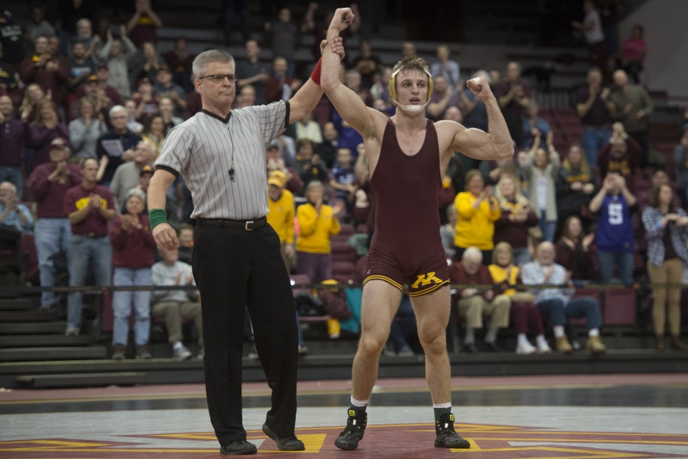 Senior Nick Wanzek at 165 beat out No. 5 Logan Massa by decision during the dual against Michigan, suffering their first loss of the season on Sunday, Jan. 21.
