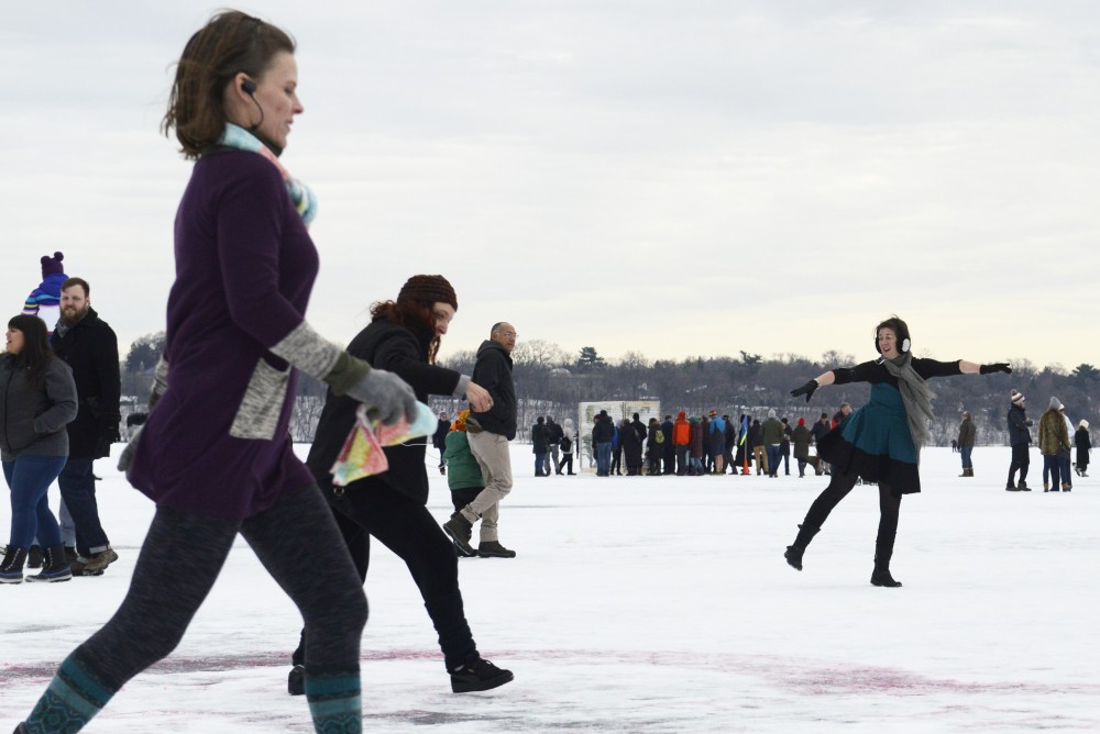 Attendees dance as part of a performance piece by artists Rae Eden, Elizabeth Fontaine, Diane Hellekson and Theresa Madaus entitled Dont You Feel It Too? during the Art Shanty Projects event on Lake Harriet in Minneapolis on Saturday, Jan. 20.