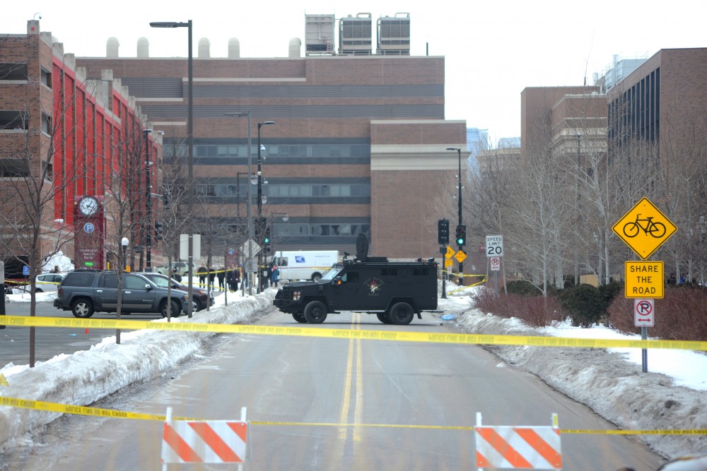 Police tape blocks off the area around the Graduate Hotel on Tuesday.