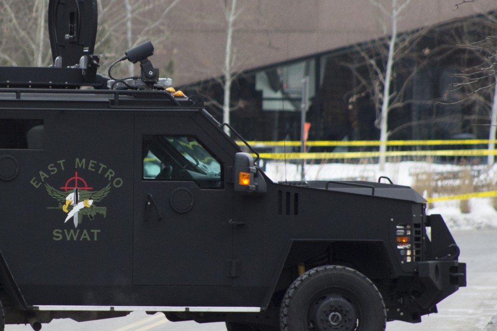 A SWAT vehicle is seen Tuesday afternoon parked near the McNamara Alumni Center in response to the standoff at the Graduate Hotel Tuesday.