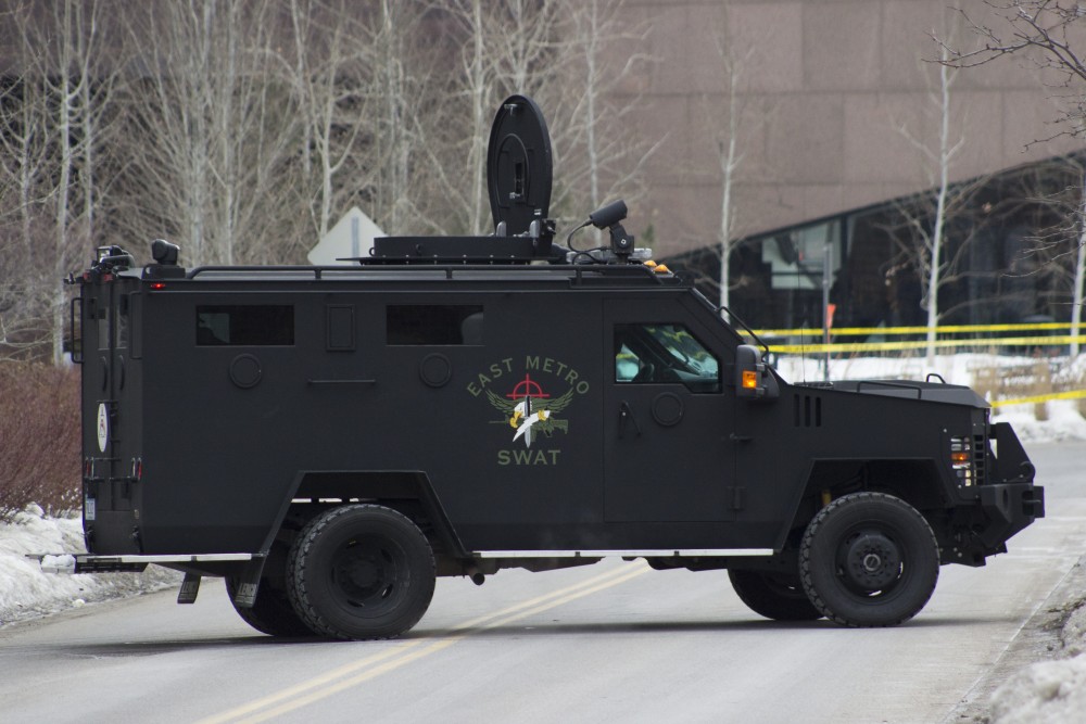 A SWAT vehicle is seen parked near the McNamara Alumni Center in response to the ongoing situation at the Graduate Hotel.