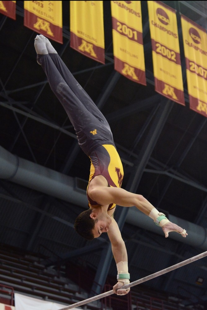 Tristan Duran competes on the high bar during the Gophers meet against the Air Force on Jan. 21, 2017. The Gophers beat the Air Force 407.700 to 395.350.