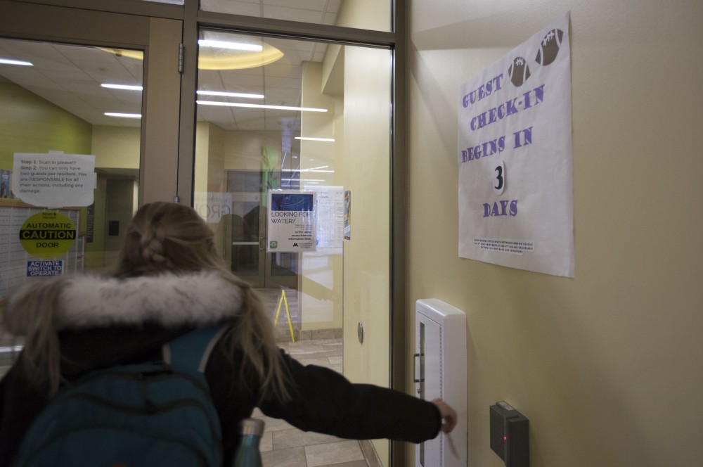The 17th Avenue Residence Hall has signs posted on its entrance doors on Tuesday, Jan. 30 in Minneapolis. University of Minnesota residence halls will have heightened security during Super Bowl weekend.
