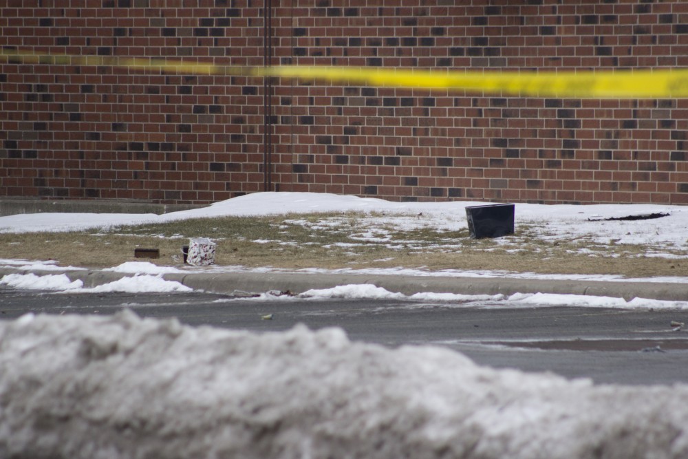 What appear to be objects thrown from a room in the Graduate Hotel lay on the ground behind police safety lines. The nearly 38-hour standoff ended in Rashad Bowmans arrest just before 2 p.m. on Tuesday, Jan. 30. 