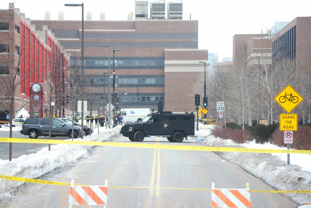 Police tape blocks off the area around the Graduate Hotel.