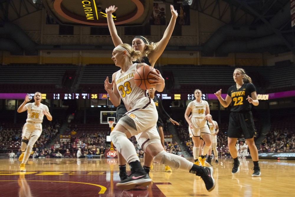 Senior guard Carlie Wagner runs the ball during a game against Iowa at Williams Arena on Jan. 21, 2018.