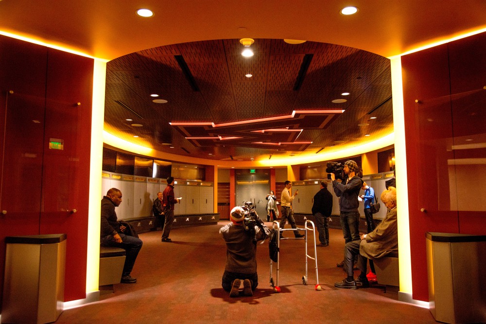 Visitors explore the Mike & Judy Wright football team locker room in the Football Performance Center on Saturday, Feb 10.