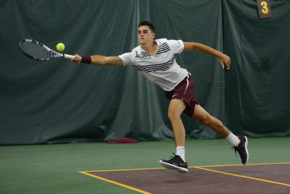 Senior Felix Corwin lunges for the ball during his doubles match against NC State on Jan. 20.