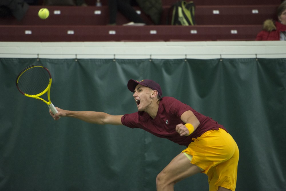 Freshman Jackson Allen returns the ball during his singles match at the Baseline Tennis Center on Friday, Feb. 2.