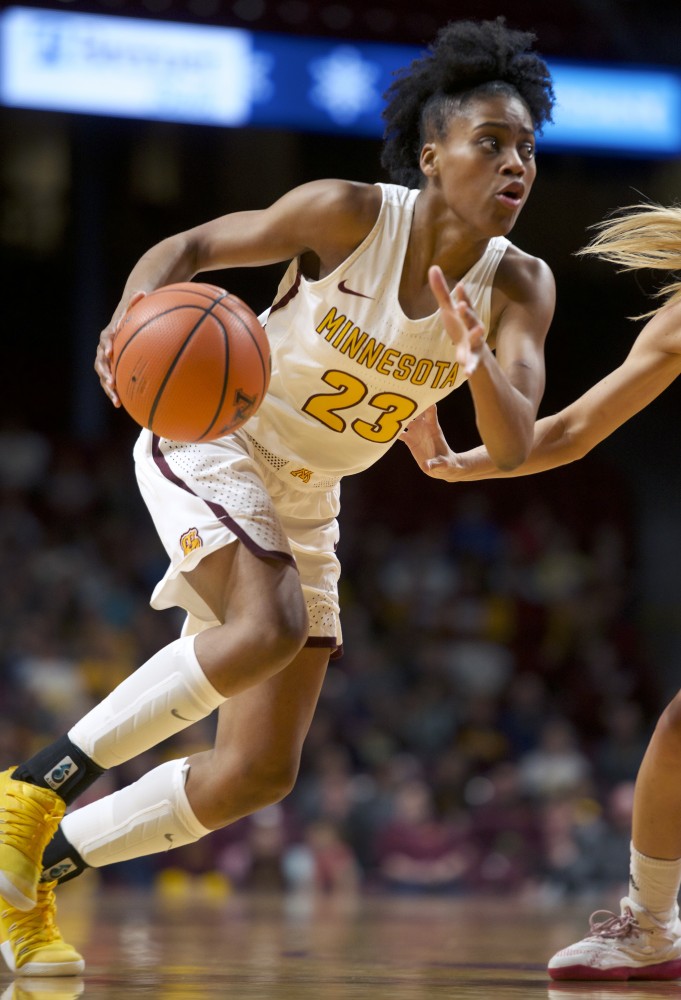 Guard Kenisha Bell runs the ball down the court during the game against Indiana on Tuesday, Feb. 20 at Williams Arena. 