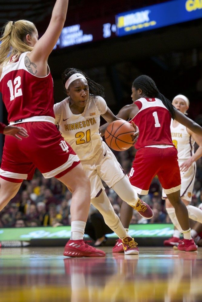Guard Jasmine Brunson maneuvers through a group of Indiana players during the game on Tuesday, Feb. 20 at Williams Arena. 