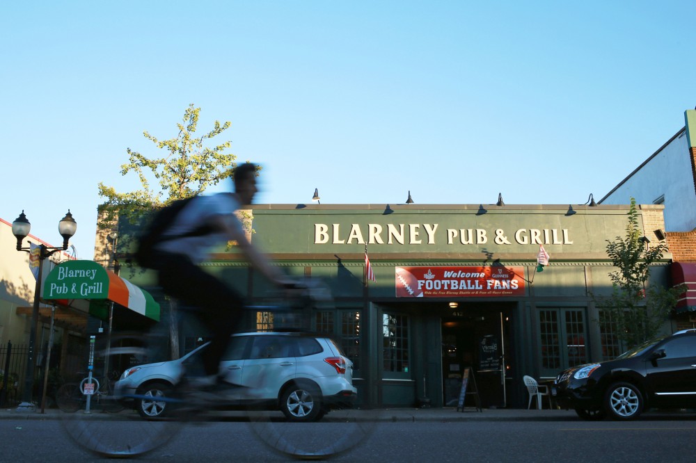 A biker passes by Blarney Pub & Grill on Sept. 30, 2015.