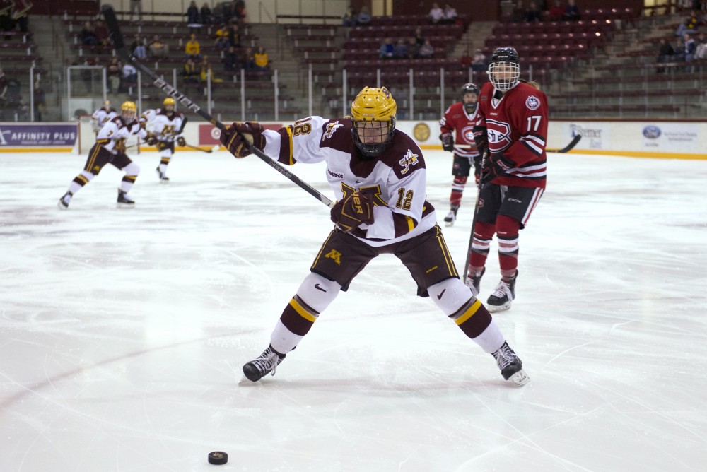 Forward Grace Zumwinkle readies to hit the puck during the first round of the WCHA Playoffs against St. Cloud State on Friday. 
