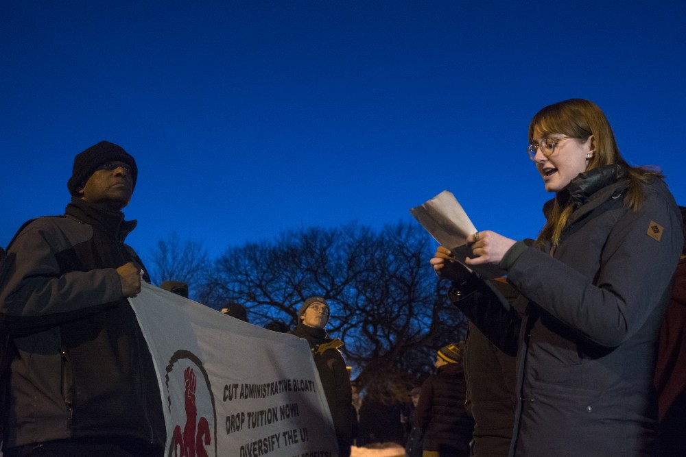 Freshman Olivia Crull speaks in opposition to conservative commentator Ben Shapiros appearance on campus out side the St.Paul Student Center on Monday, Feb. 26.