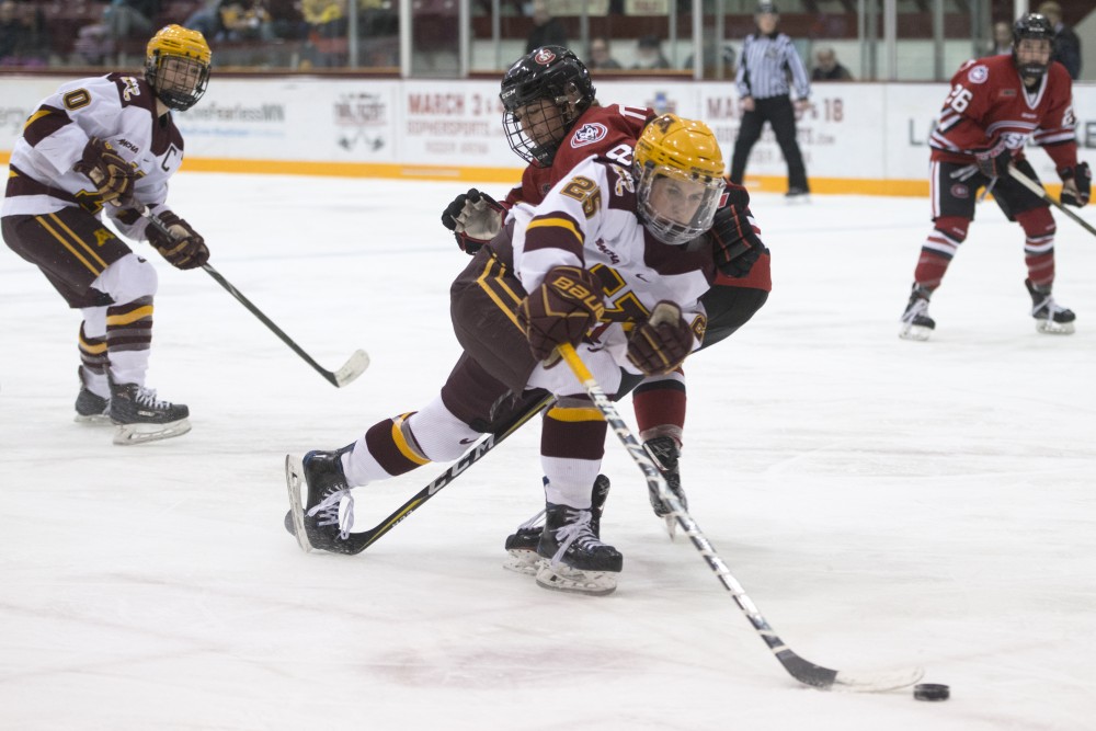 Forward Nicole Schammel passes the puck during a game against St. Cloud State at Ridder Arena on Friday, Feb. 23.