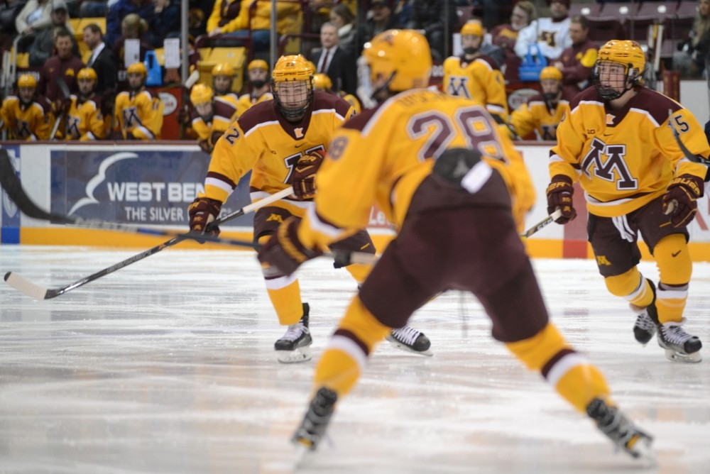 Tyler Sheehy, left, and Rem Pitlick, right, watch a play unfold at 3M Arena at Mariucci on Feb. 4, 2017.