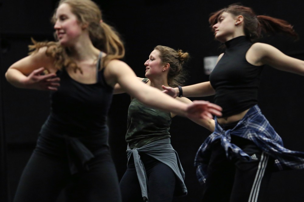Katie Kummerow, center, runs through a class-choreographed combination on Thursday, Feb. 22 at Barbara Baker Dance Center on West Bank. The modern dance class learned by dancing from their teacher and with each other, a format typical to the University dance program.