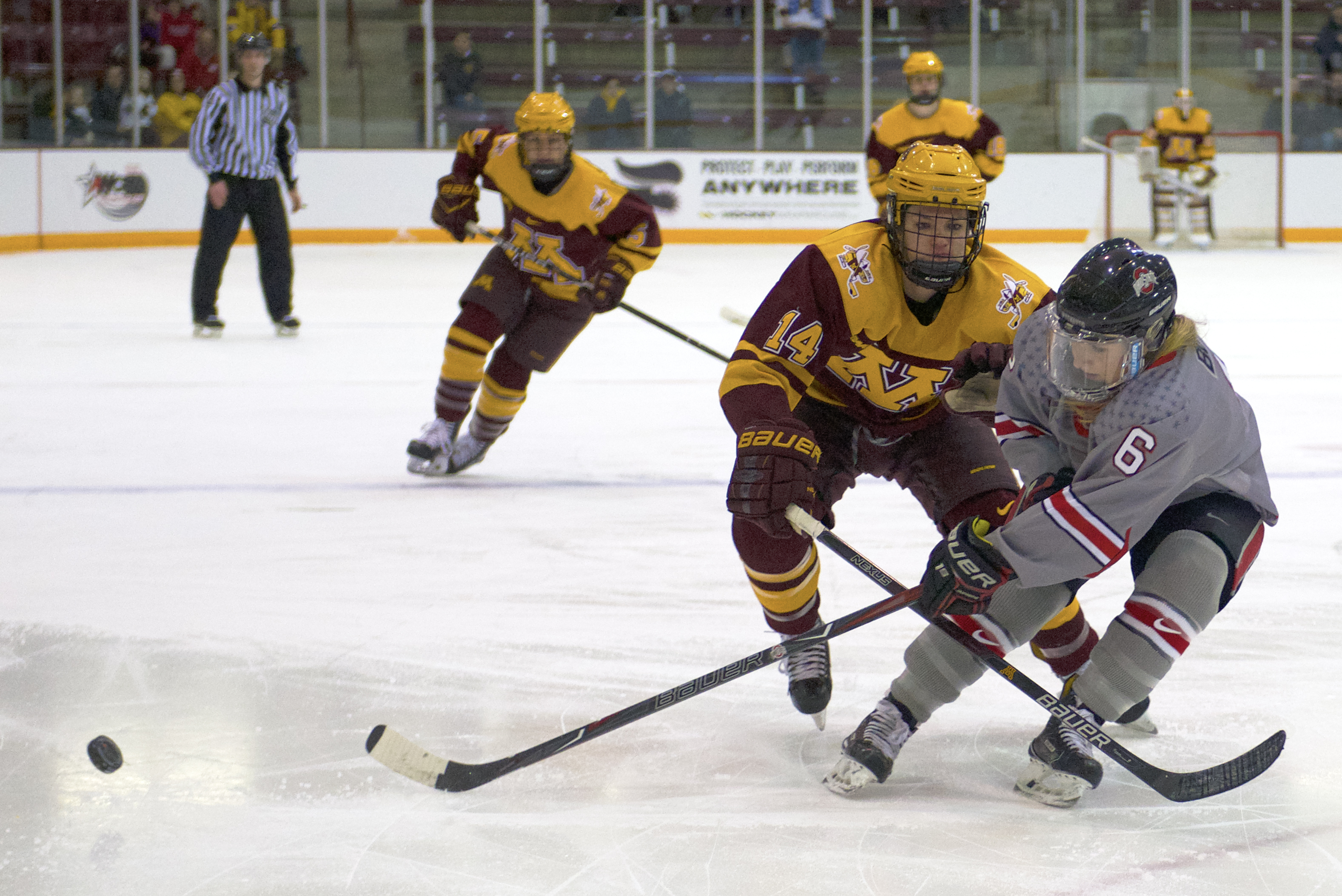 Forward Lindsay Agnew fights for the puck during a game against Ohio State for the WCHA Final Faceoff semifinal on March 3 at Ridder Arena.