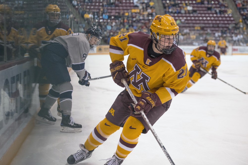 Forward Casey Mittelstadt follows the puck during the Gophers game against Penn State on Sunday at 3M Arena at Mariucci.