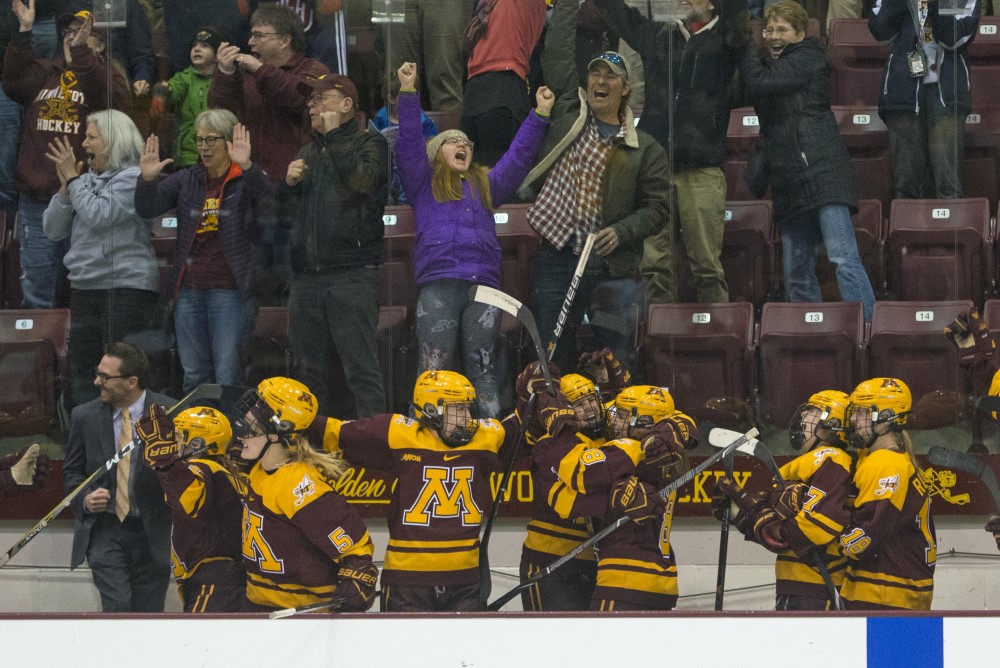 The Gophers celebrate their empty-net goal late in the third period to seal their victory in the WCHA championship game against Wisconsin at Ridder Arena on Sunday, March 4.