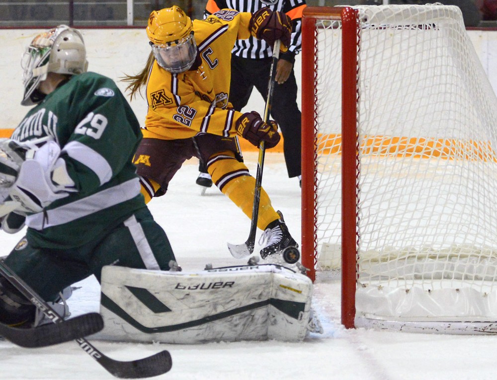 Forward Hannah Brandt scores a goal at Ridder Arena on Nov. 14, 2015, when the Gophers defeated Bemidji State 8-3.