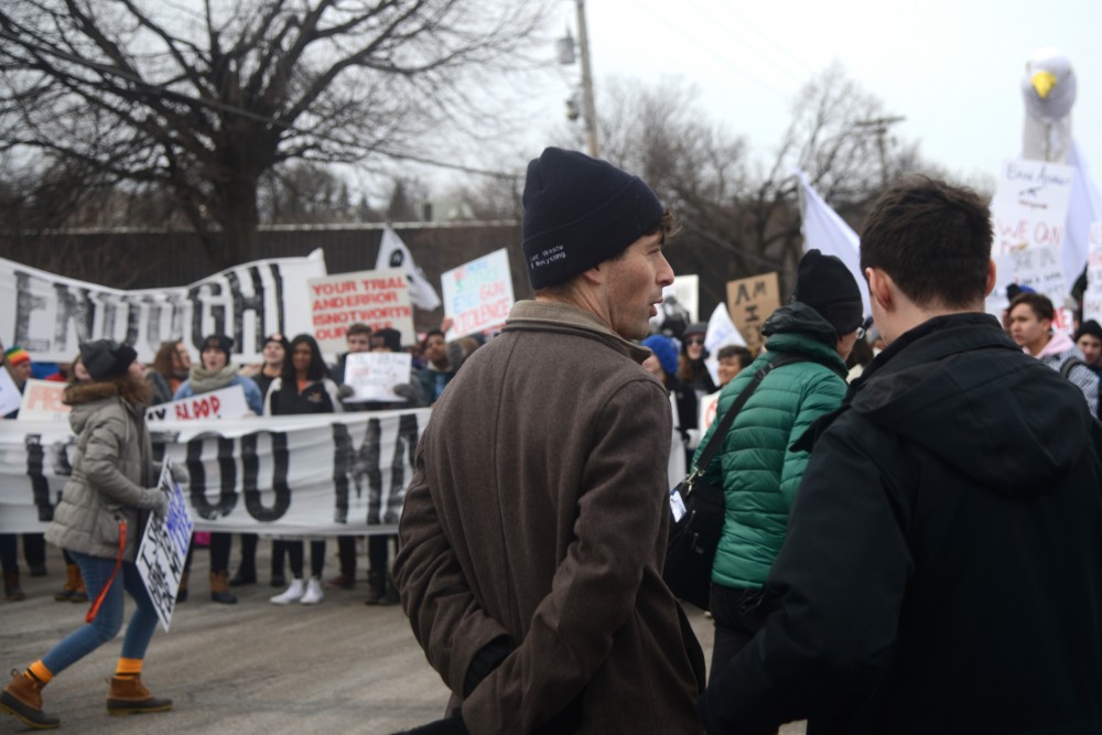 Minneapolis Mayor Jacob Frey, left, speaks with a colleague at Harriet Island Regional Park, as the March for Our Lives Minnesota crowd begins to move on Saturday, March 24. Frey spoke with many of the teenagers and children that were in the front line of the march.