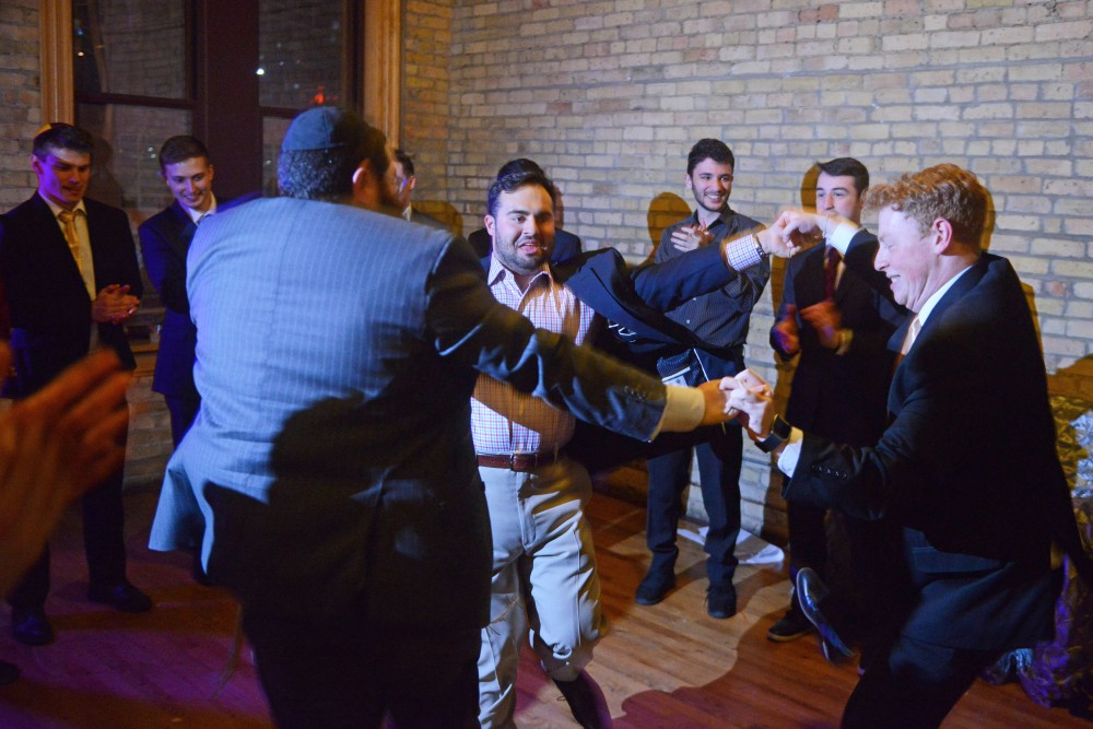 The groom, Eli Singer, right, dances with friends during the My Big Fat Jewish Wedding event at Day Block Event Center downtown on Thursday, March 22.