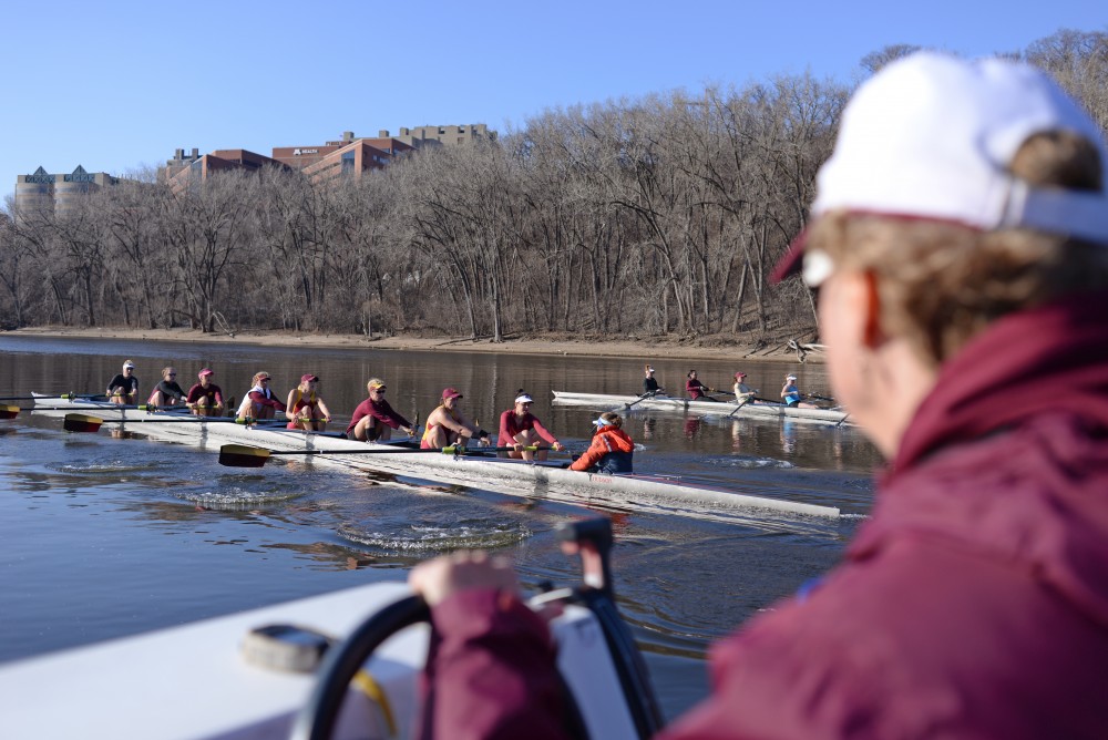 The University of Minnesota rowing team practices on Tuesday, March 27 on the Mississippi River.