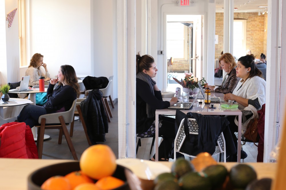 The Coven is filled with working women on Tuesday, March 27 in the North Loop. The space encourages women and non-binary individuals to find community while accomplishing personal and professional work in the space.