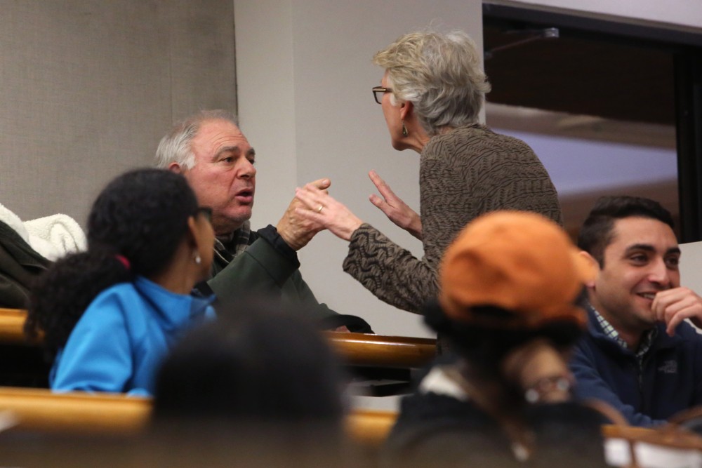 National Rifle Association member Peter Christodoulou argues with the Town Hall on Gun Violence moderator Barbara Frey on Monday, March 26 in Walter F. Mondale Hall. Christodoulou expressed anger toward new Minnesota gun legislation as Frey asked him to be respectful of the speakers.