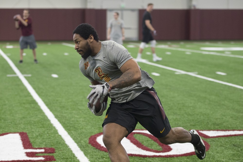 Kobe McCrary runs the ball in an NFL Pro Day drill at the Athletes Village indoor practice facility on Wednesday, March 28. 