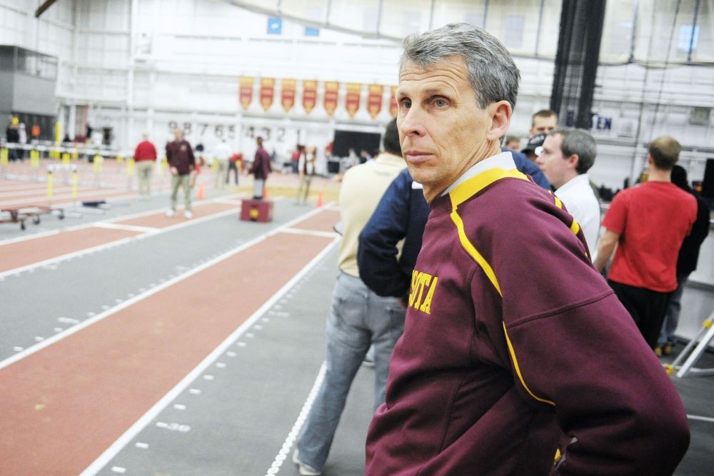 Head mens track and field coach Steve Plasencia watches his team compete last February. Plasencia won his first five Big Ten championships with Minnesota from 2009-11 but finished second indoors and seventh outdoors this season.