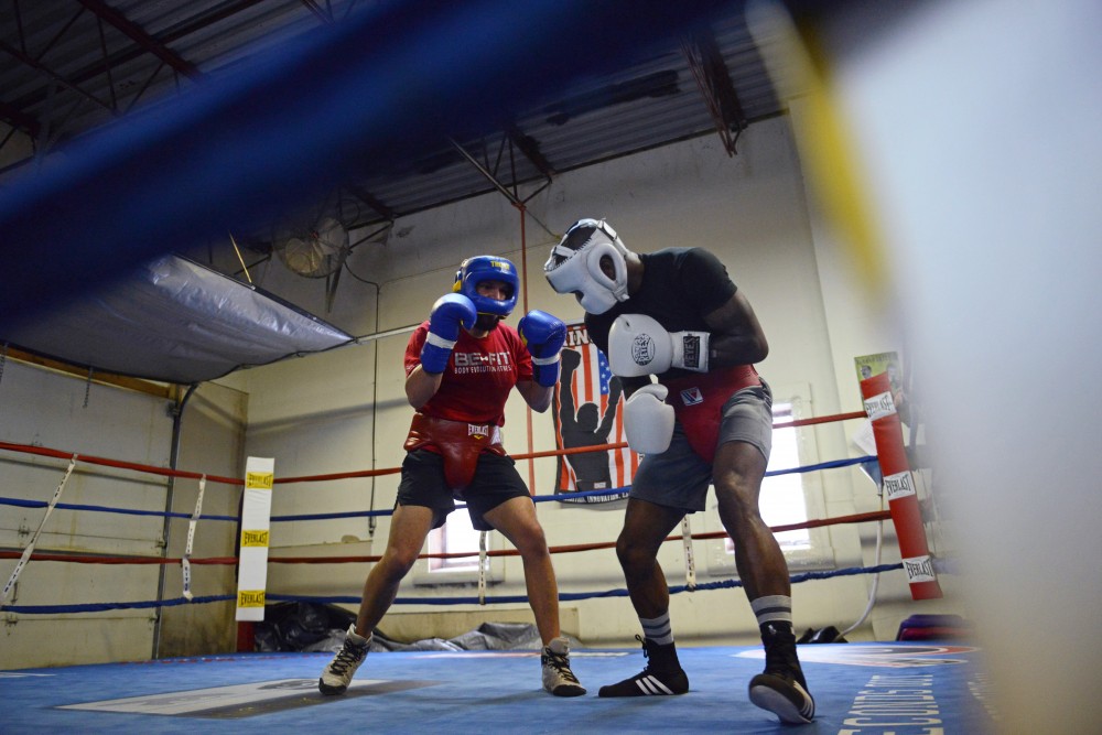 Caleb Truax, left, spars against Ronald Mixon during practice at Anoka Coon Rapids Boxing Gym on Tuesday, March, 20.